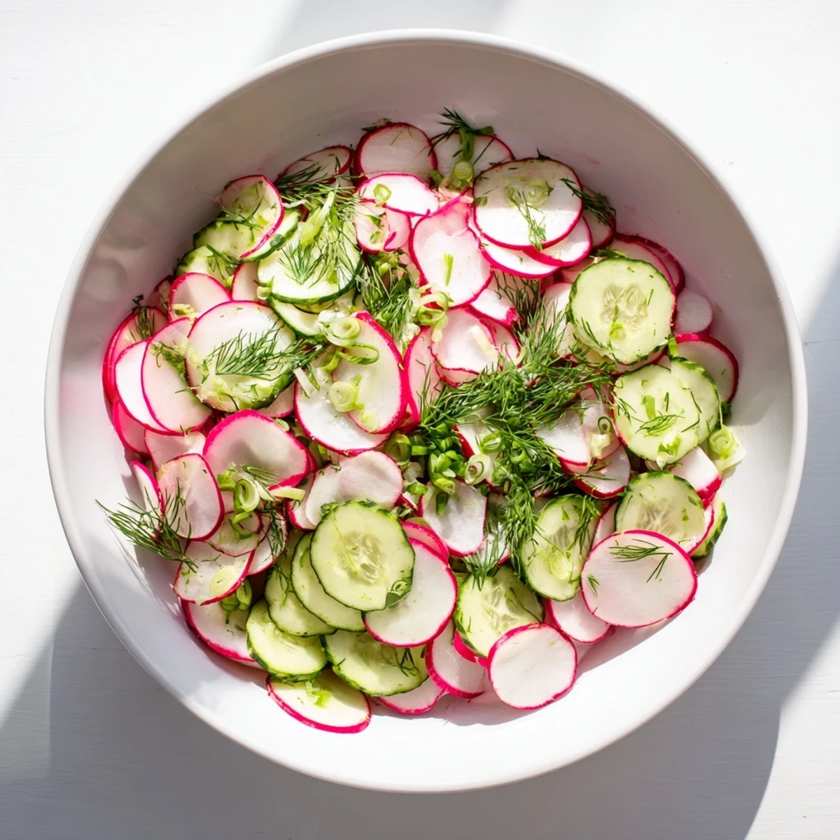 Crisp thinly sliced radishes and cool cucumber ribbons coated in olive oil and mustard dressing
