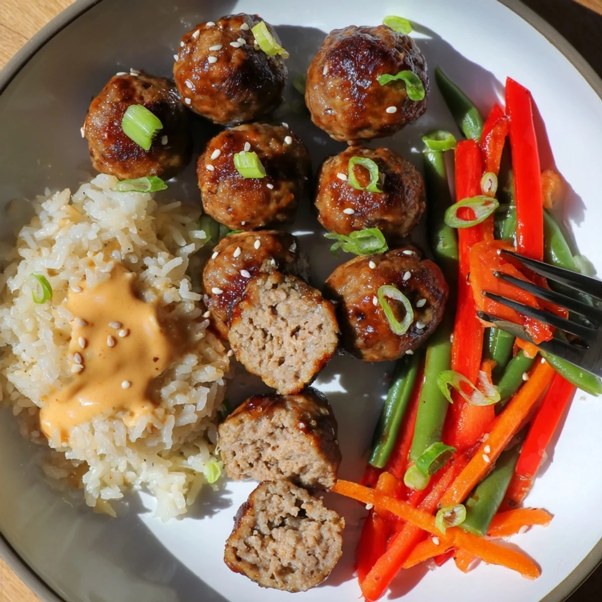 Hello Fresh Firecracker Meatballs glazed in sticky spicy sweet sauce over jasmine rice