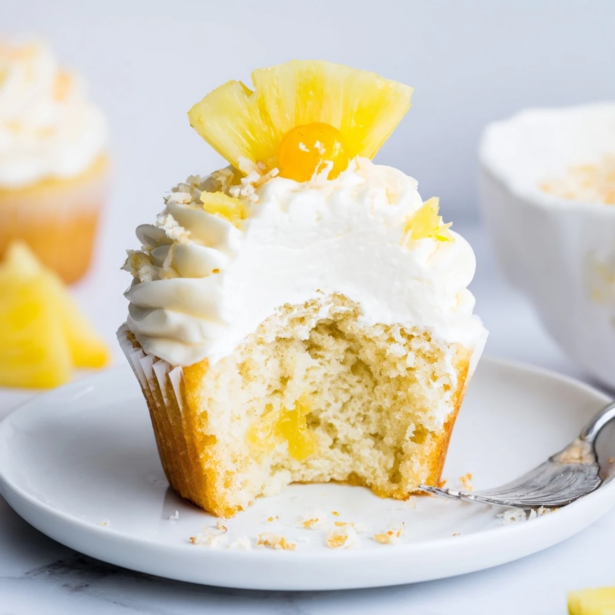 Dole Whip Cupcakes Recipe showcases fluffy pineapple treats topped with creamy frosting