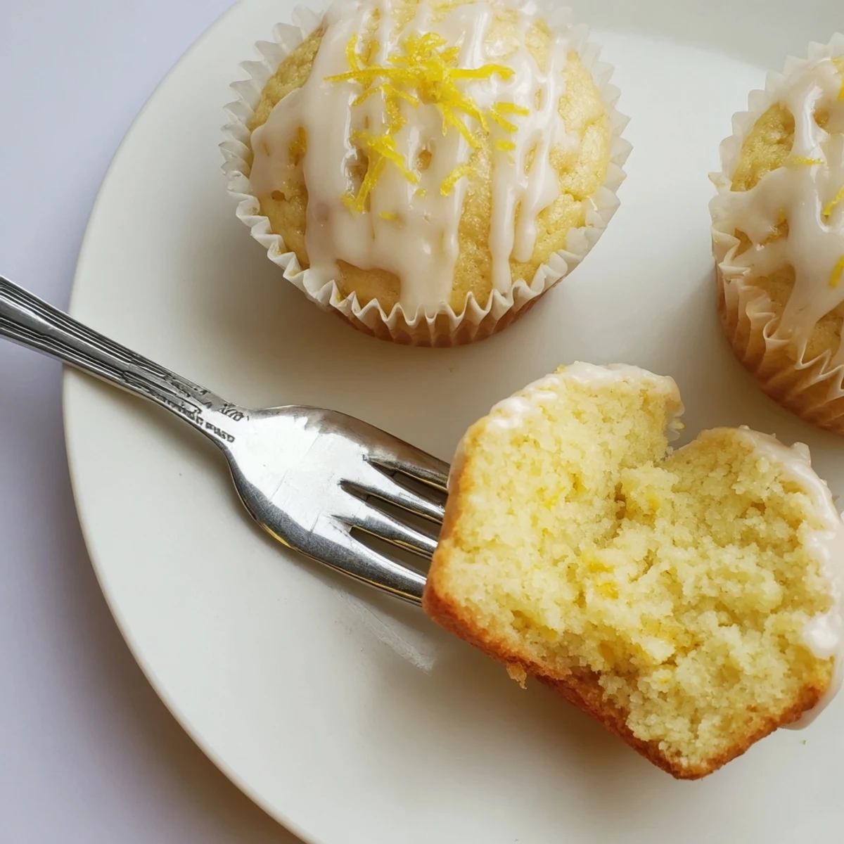 Fresh Glazed Lemon Ginger Muffins served warm with tea, bright citrus aroma