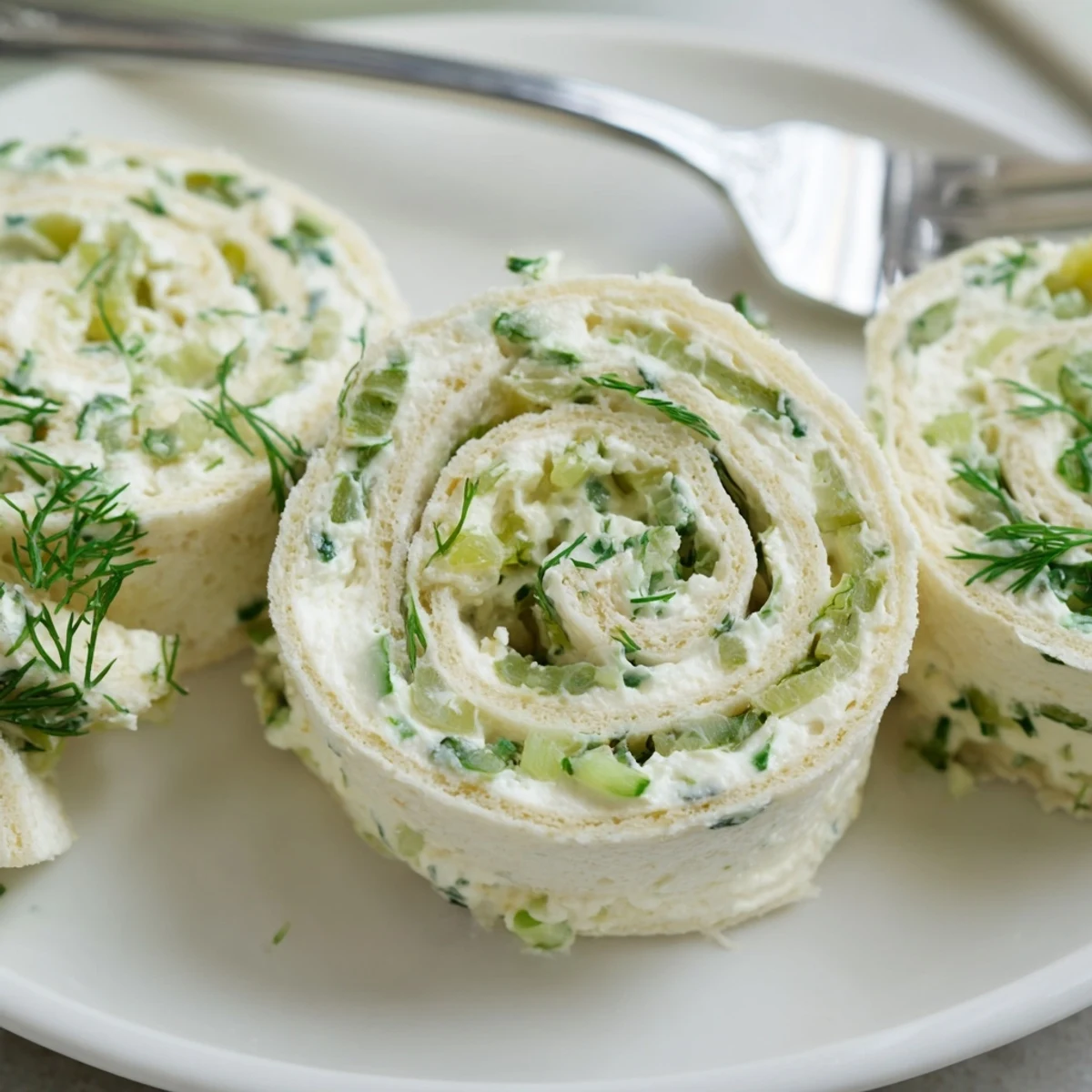 Creamy, tangy Pickle Dip Pinwheels arranged on platter, chilled and ready to serve