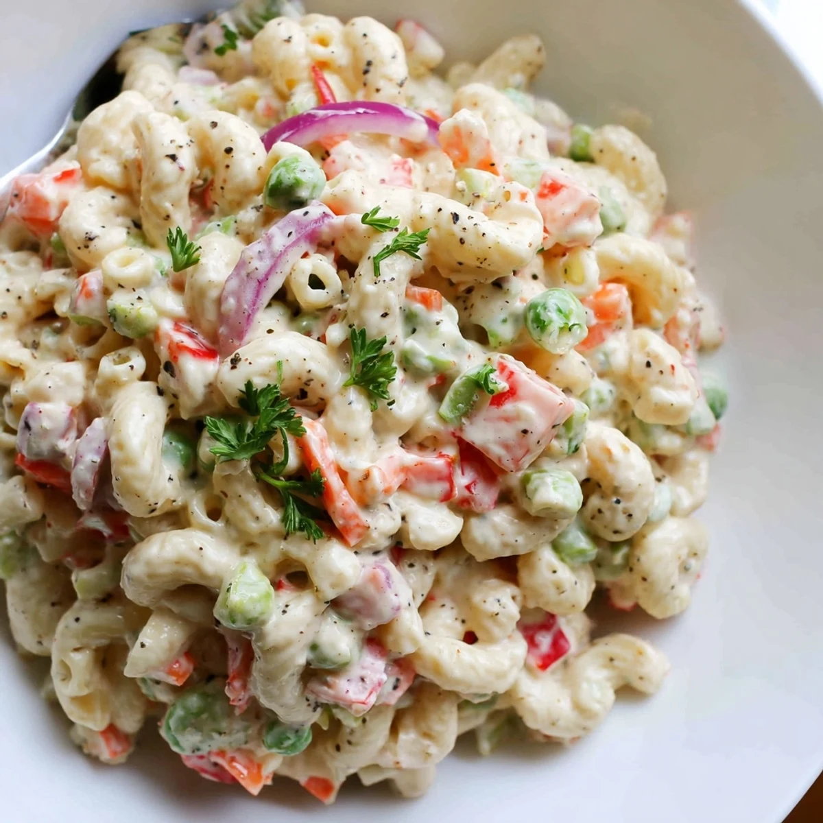 Family style Macaroni Salad tossed in tangy Dijon dressing, colorful summer side.