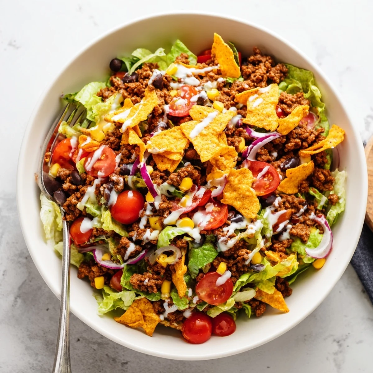 Bowl of Simple Doritos Taco Salad with crisp romaine and zesty ranch.