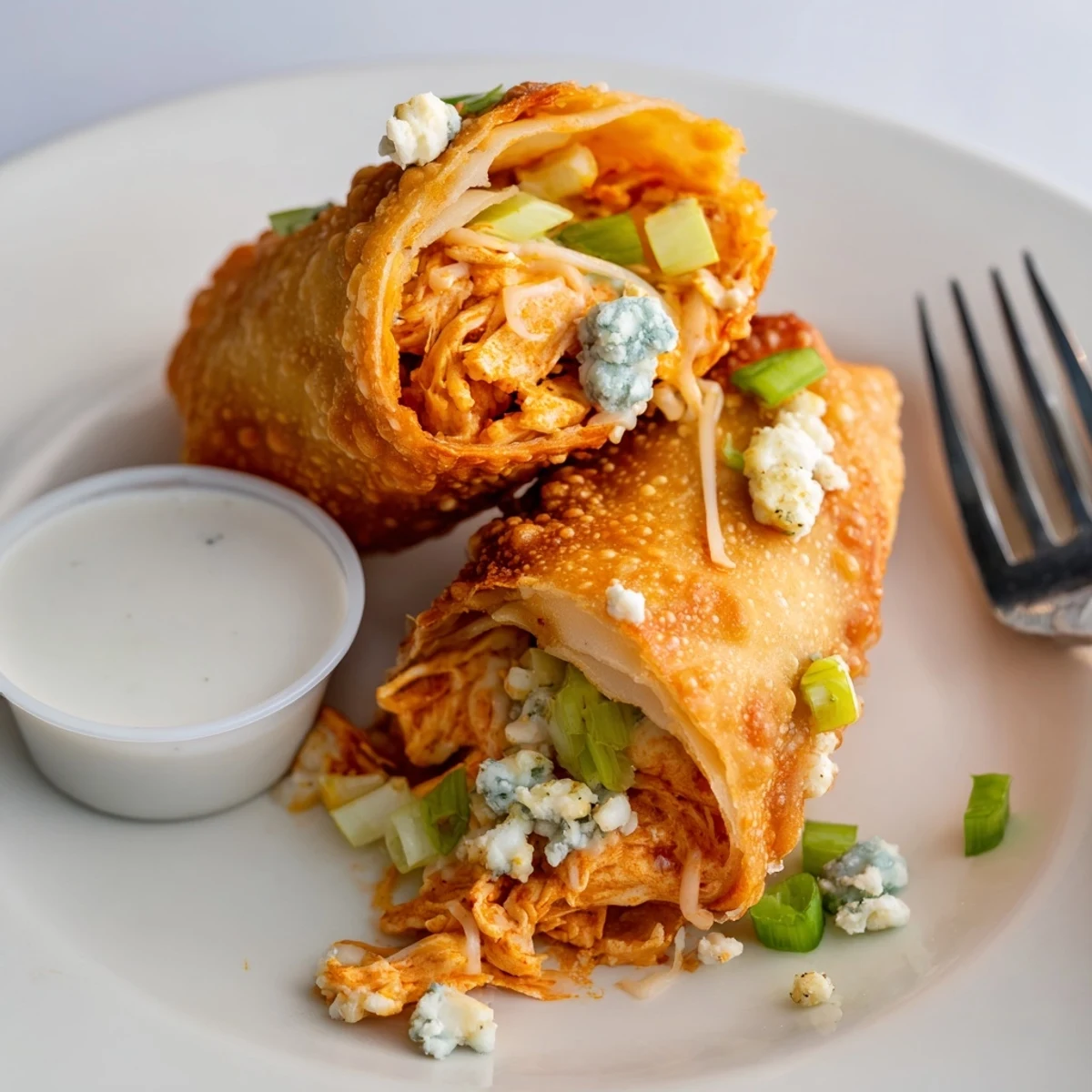 Baked option Buffalo Chicken Egg Rolls Recipe served warm with blue cheese