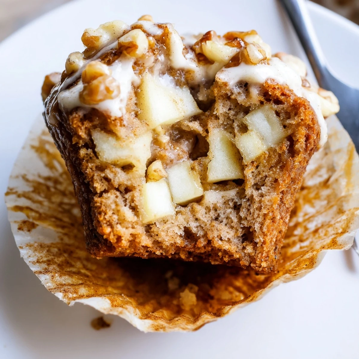 Warm, tender bite of Healthy Apple Cinnamon Greek Yogurt Muffins studded with apples