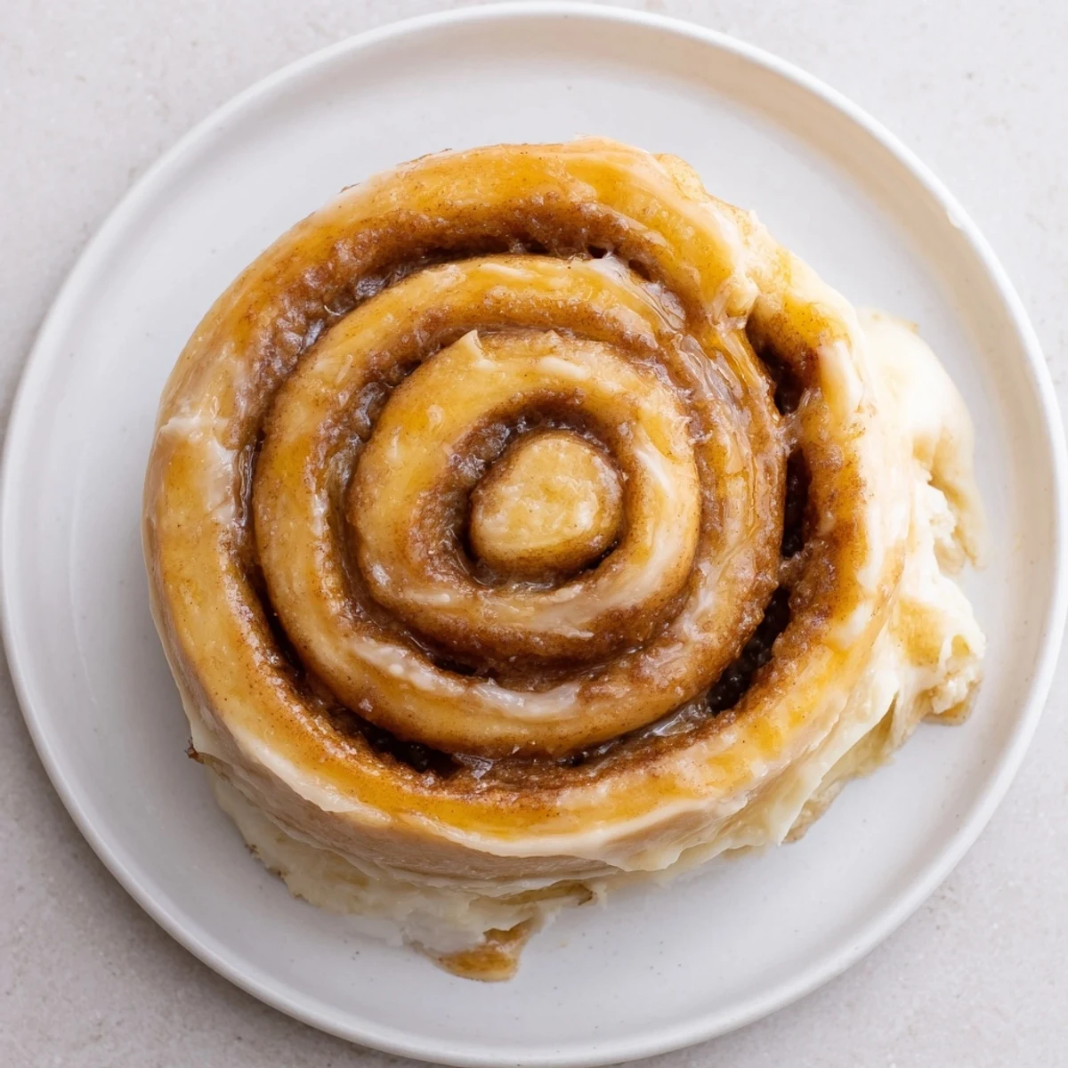 Freshly baked Banana Bread Cinnamon Rolls cooling on rack, perfect for brunch.
