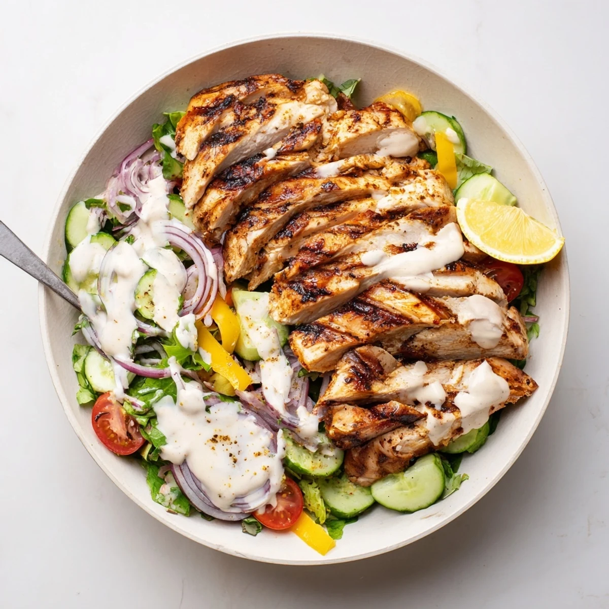 Chicken Shawarma Salad Recipe with grilled spiced chicken, mixed greens, and yogurt