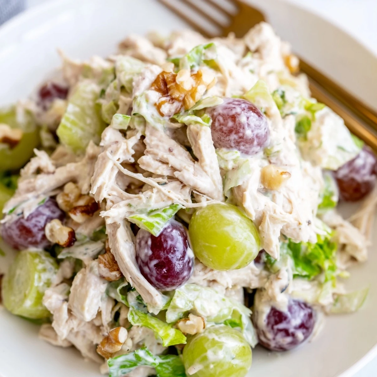 Chicken Salad With Creamy Yogurt Dressing Recipe piled on mixed greens, juicy grapes  