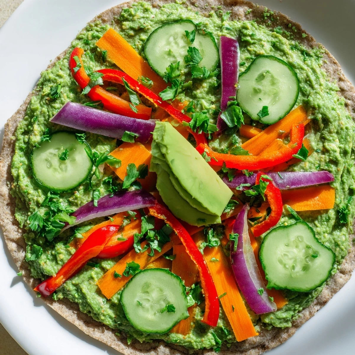Close-up of handheld spinach hummus lunch wrap showcasing crunchy vegetable filling inside soft tortilla