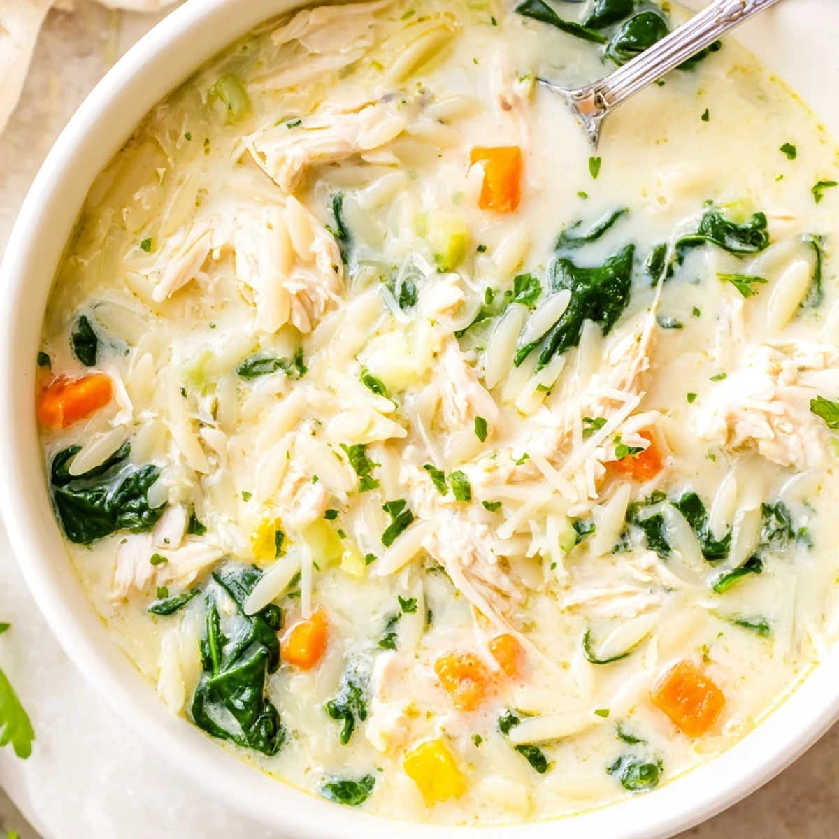 Creamy Chicken Florentine Soup With Orzo served with crusty bread, rich broth