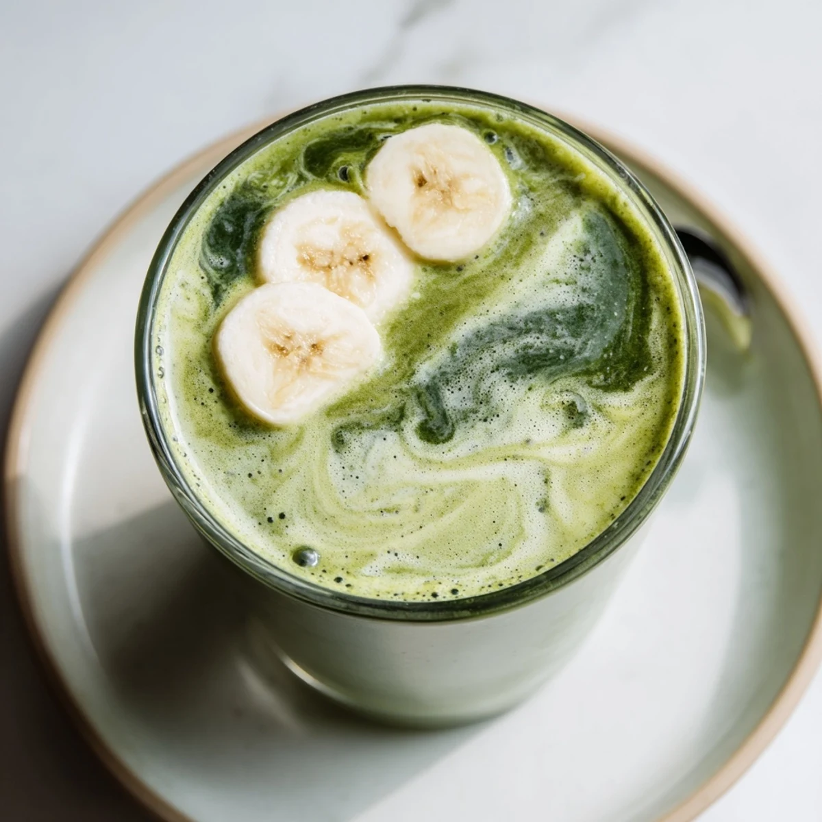Vegan Matcha Smoothie beside blender, smooth texture, morning breakfast pick-me-up