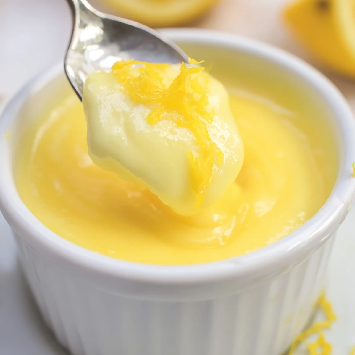 Bright Homemade Lemon Curd spread on toast, tangy smoothness with buttery sheen