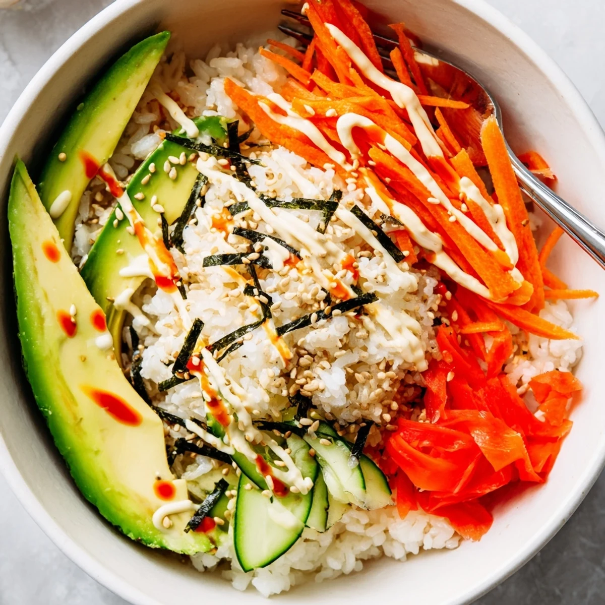 Weeknight California Roll Sushi Bowls topped with nori strips, pickled ginger, soy sauce
