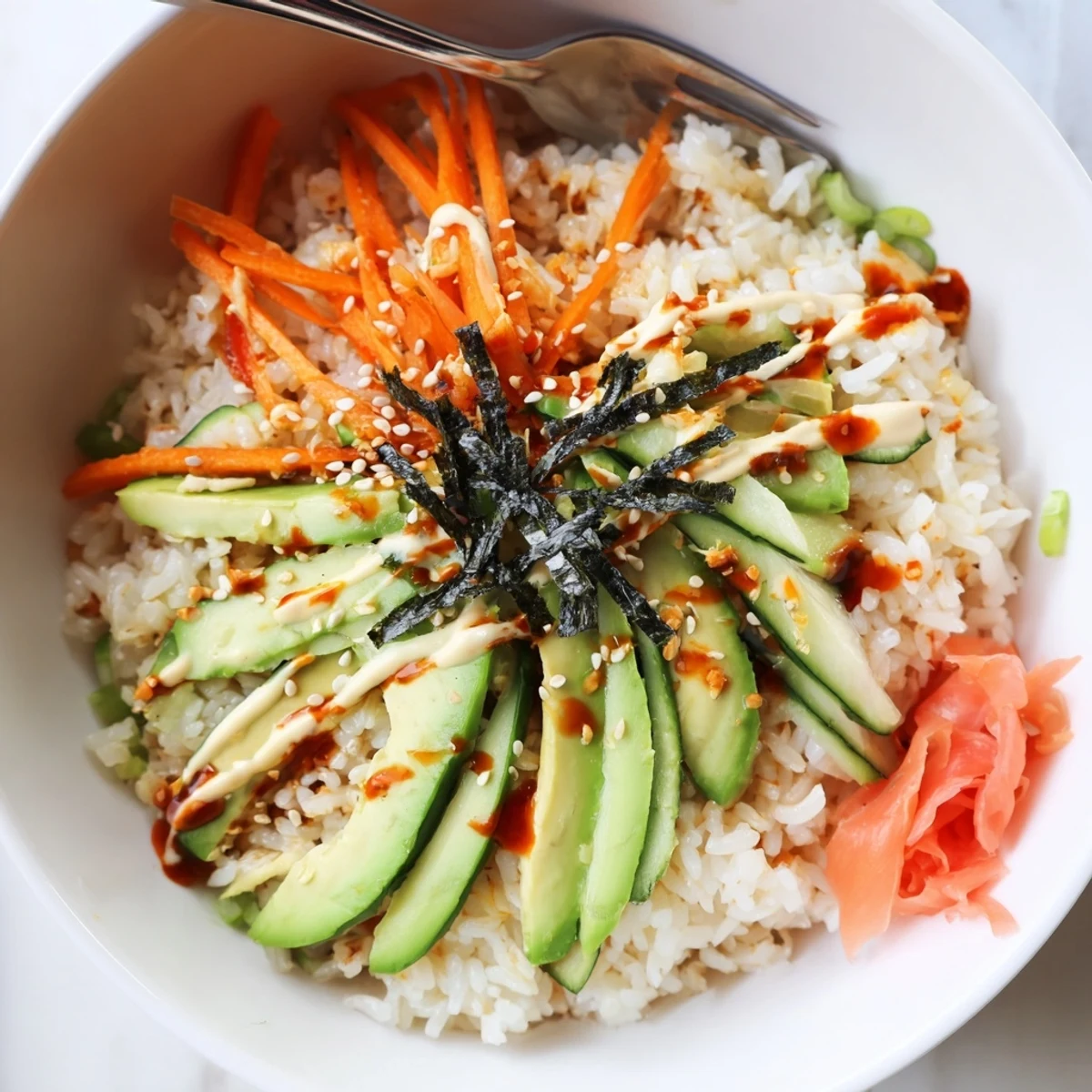 Layered California Roll Sushi Bowls: seasoned sushi rice, shredded crab, spicy mayo drizzle