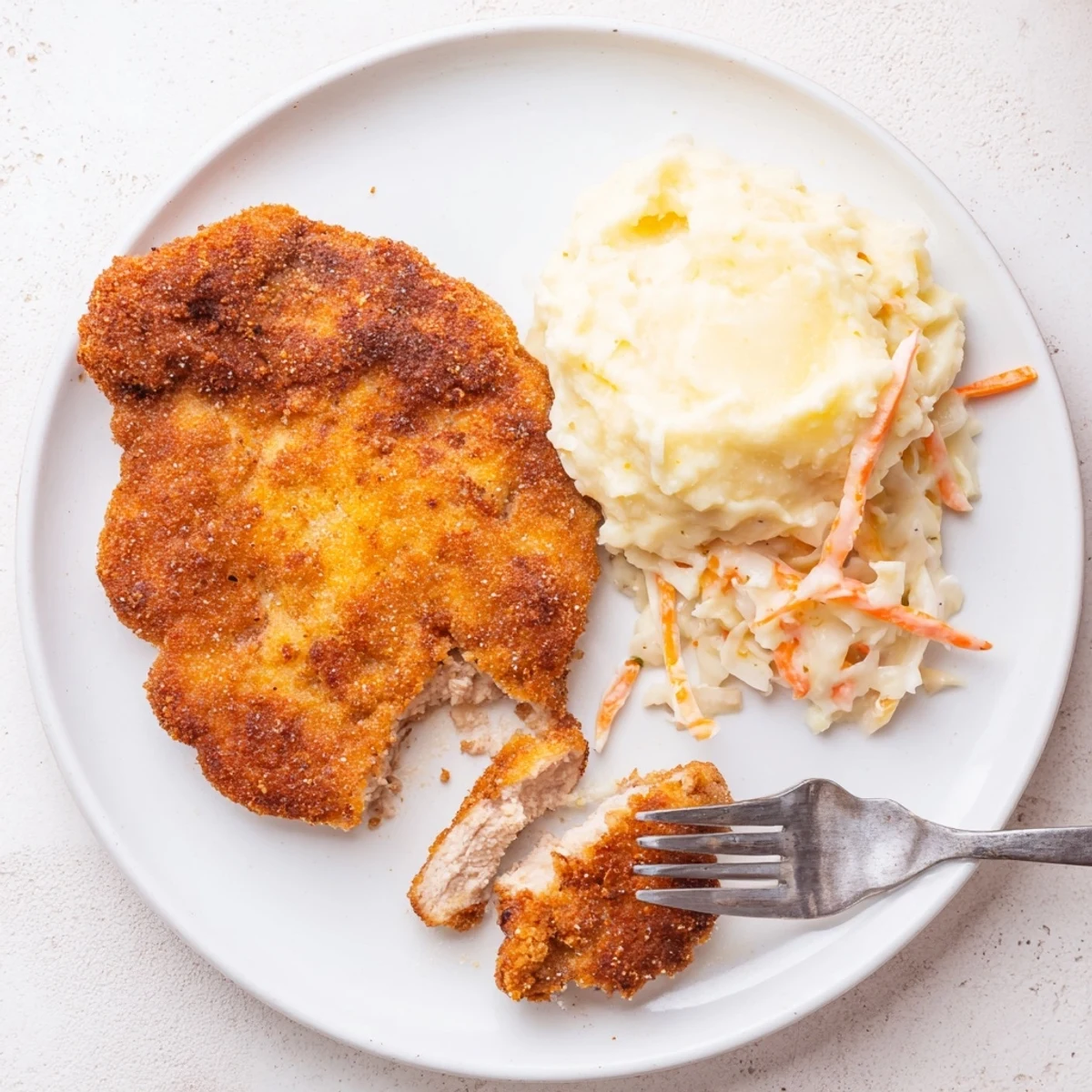 Skillet Fried Chicken Breast with crunchy coating, herb flecks, sandwich-ready
