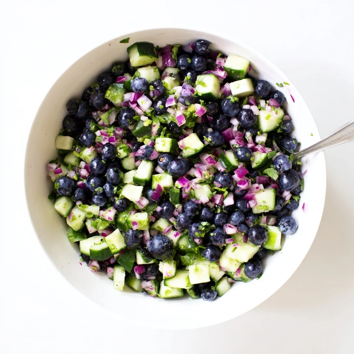 Fresh blueberry cucumber salsa bursting with juicy berries and crisp diced vegetables