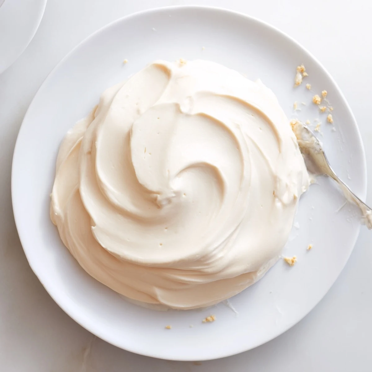 Smooth Italian Meringue Buttercream piped into elegant rosettes on cupcakes