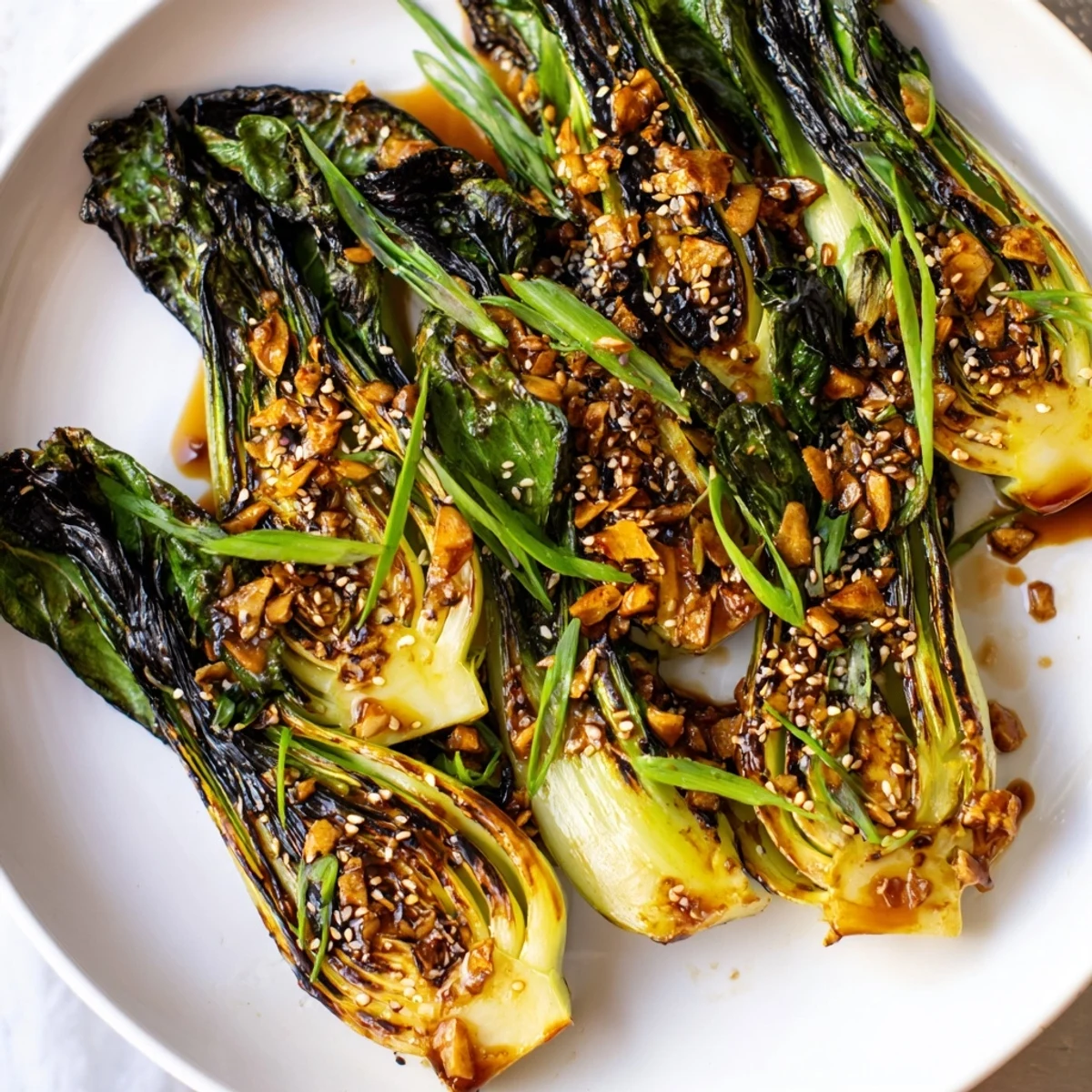 Caramelized garlic bok choy sizzling in a hot wok with golden crispy garlic slices