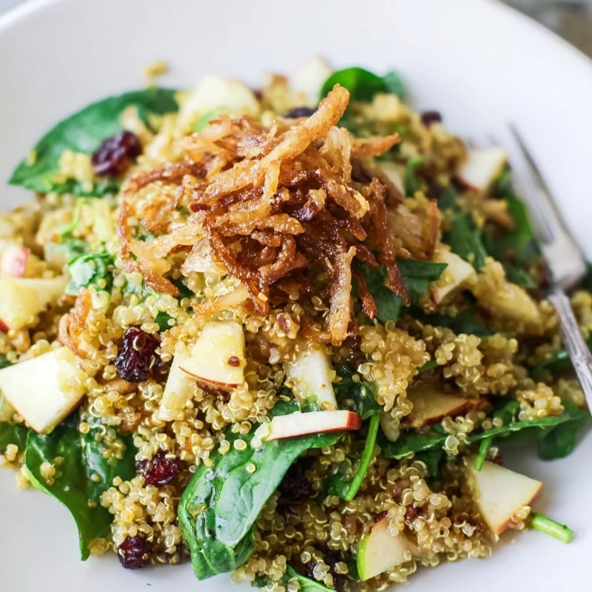 Fluffy quinoa tossed with diced apples and arugula in honey mustard quinoa apple salad.