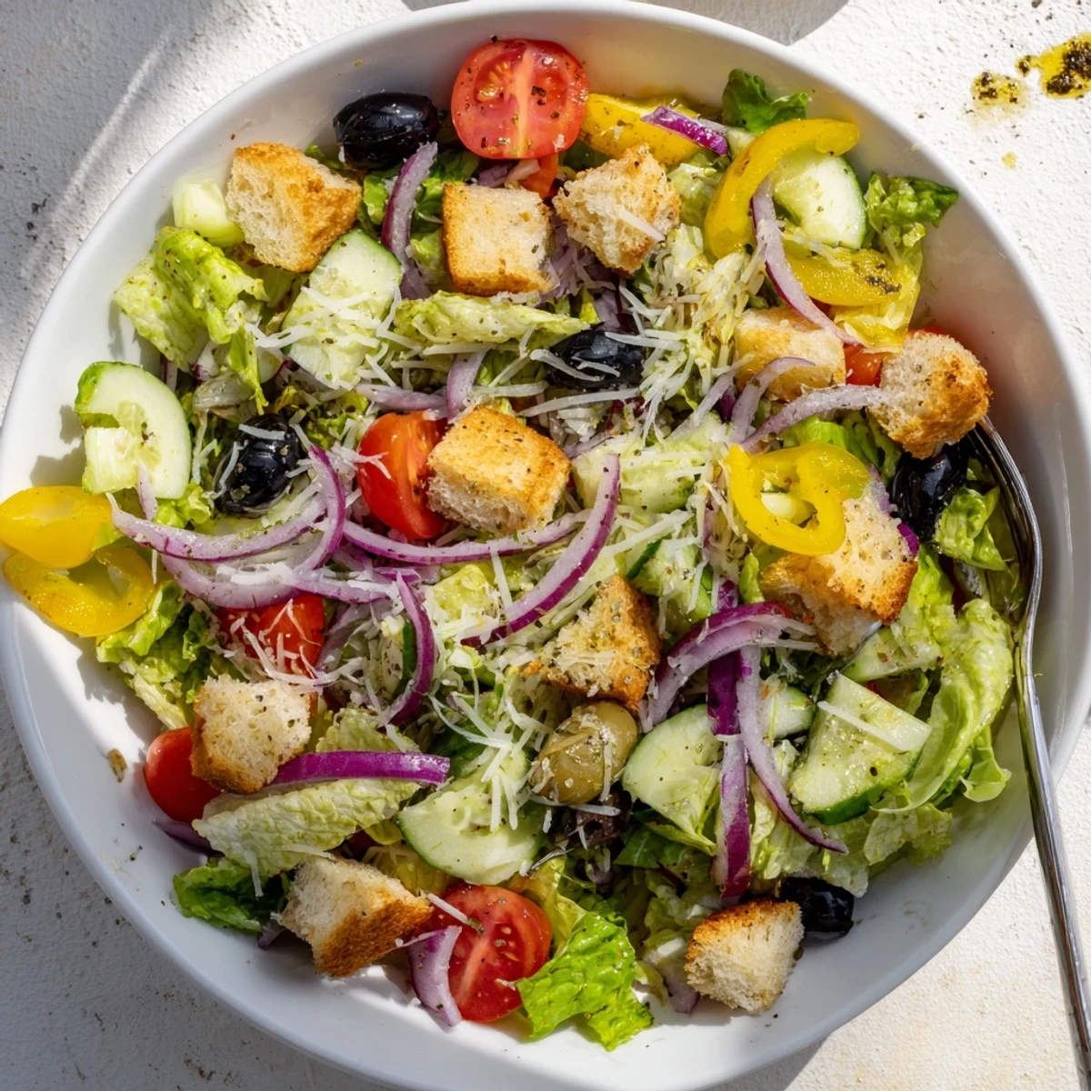 Crisp Olive Garden Salad tossed in tangy Italian dressing with crunchy croutons and fresh vegetables