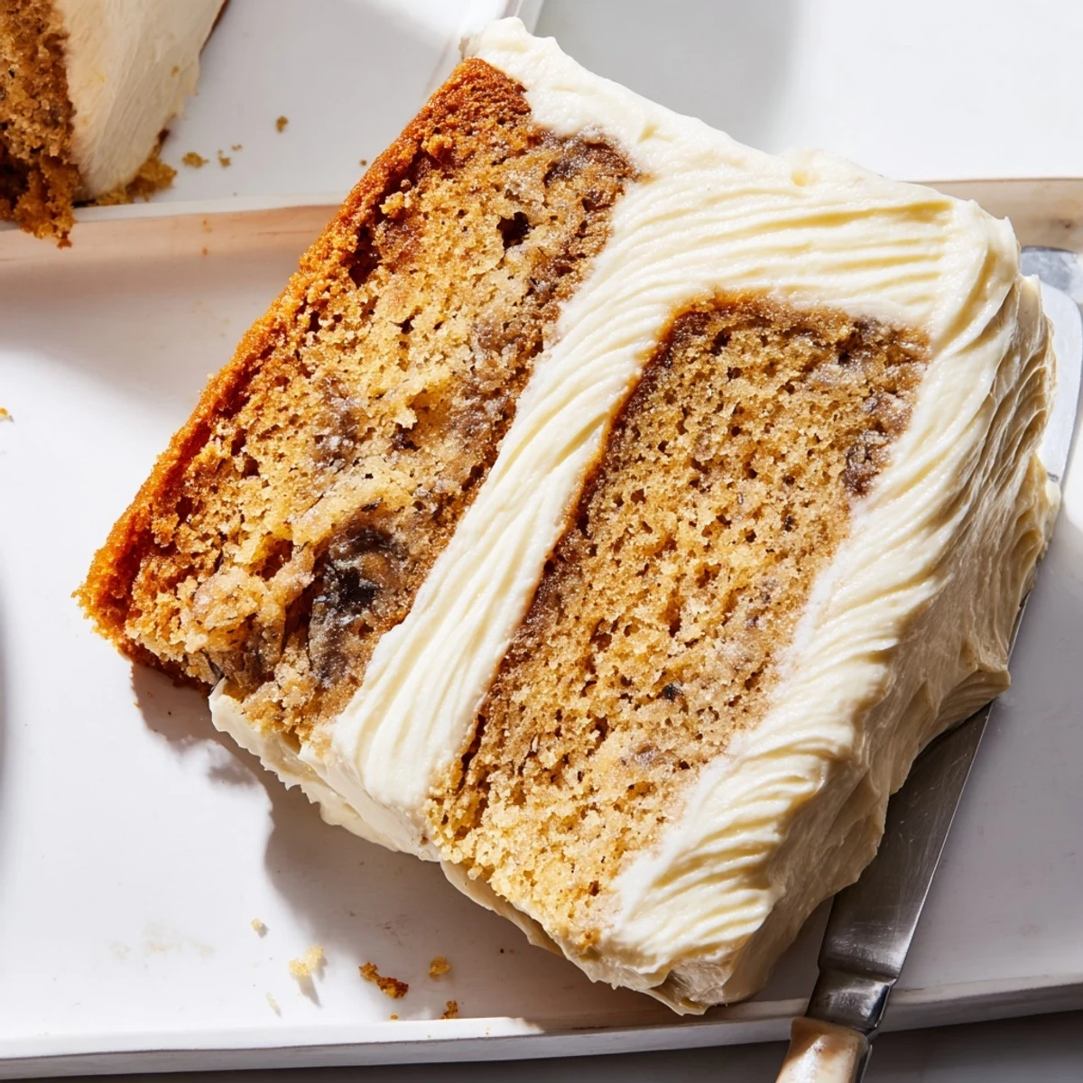 Moist brown butter banana cake topped with generous swirls of sweet cream cheese frosting