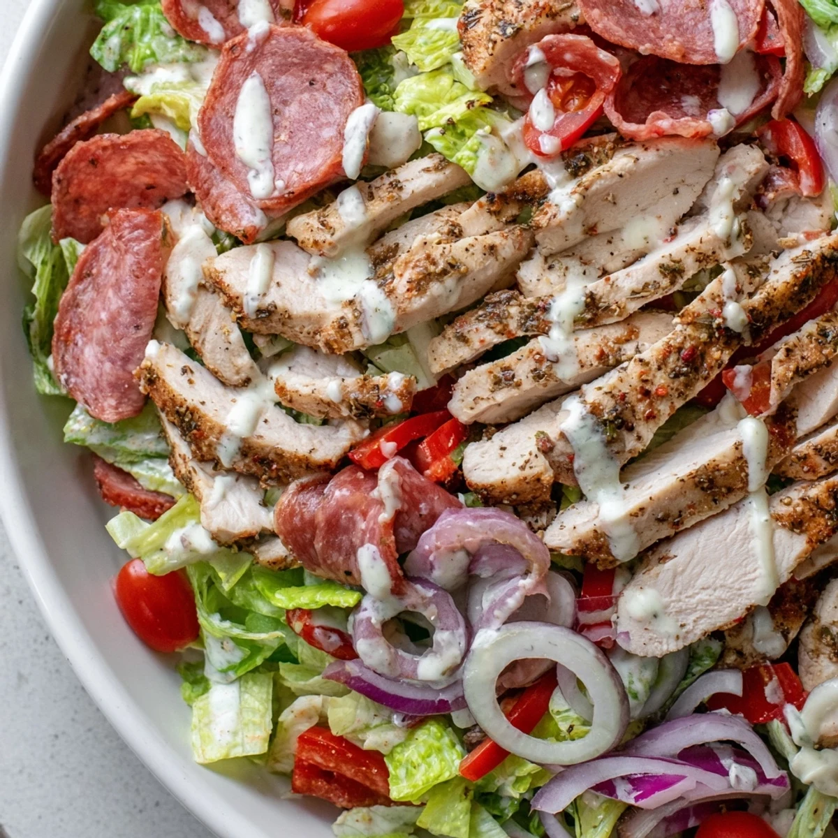 Italian grinder chicken salad loaded with salami, provolone, and crisp romaine lettuce