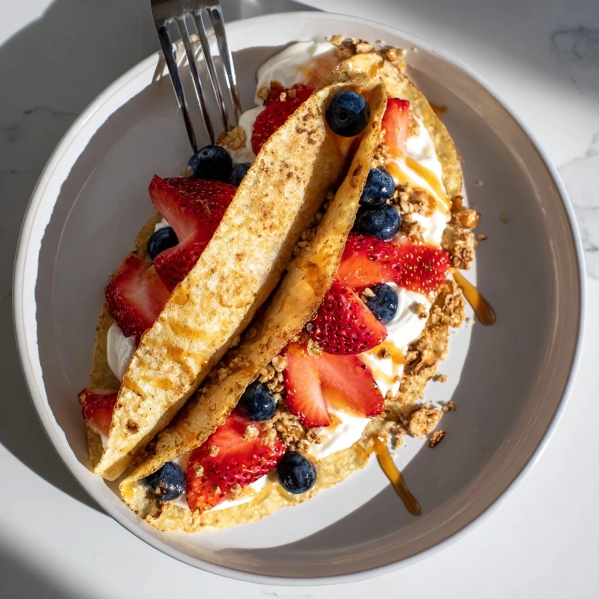 Golden pancake tacos stuffed with scrambled eggs and crispy bacon for a savory breakfast.
