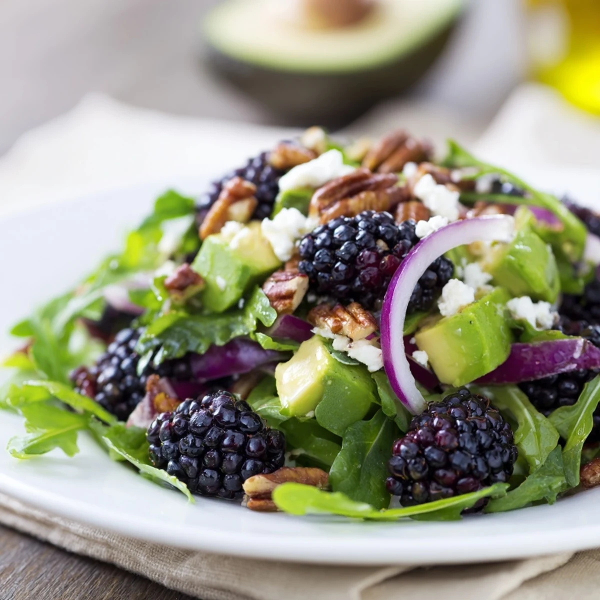 Crisp Blackberry Avocado Salad featuring ripe avocado, juicy blackberries, and tangy lime dressing.
